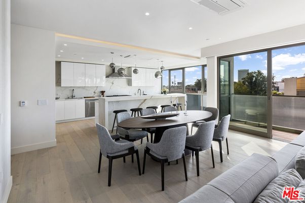 Dining room, Interior, Kitchen, Marble Walls, Pendant Lights, Recessed Lighting, Stainless Steel Appliances, Wood Texture Flooring