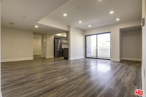 Empty room, Interior, Recessed Lighting, Stainless Steel Appliances, Wood Texture Flooring