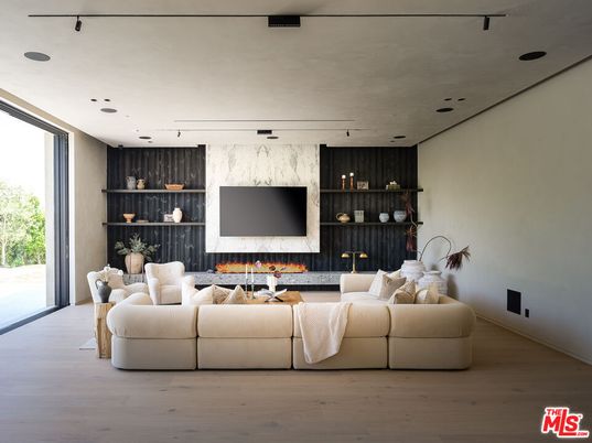 Fireplace, Interior, Living room, Marble Walls, Recessed Lighting, Wood Texture Flooring
