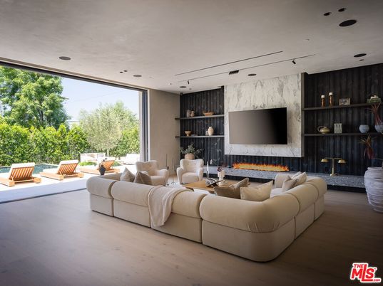 Fireplace, Interior, Living room, Marble Walls, Recessed Lighting, Wood Texture Flooring