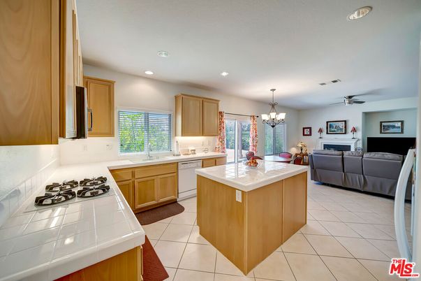 Chandelier, Dining room, Fireplace, Interior, Kitchen, Living room, Recessed Lighting, Tile Countertops