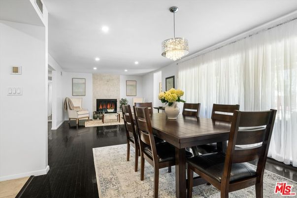 Chandelier, Dining room, Fireplace, Interior, Living room, Recessed Lighting, Wood Texture Flooring
