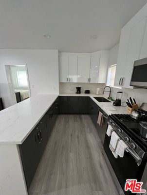 Interior, Kitchen, Marble Walls, Recessed Lighting, Wood Texture Flooring