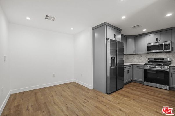 Interior, Kitchen, Recessed Lighting, Stainless Steel Appliances, Wood Texture Flooring