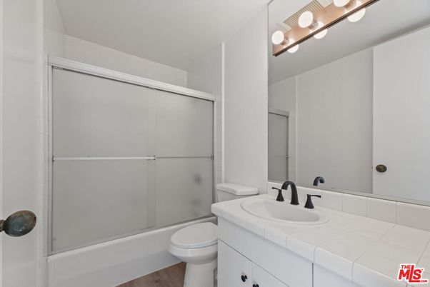Bathroom, Glass Shower, Interior, Tile Countertops, Wood Texture Flooring