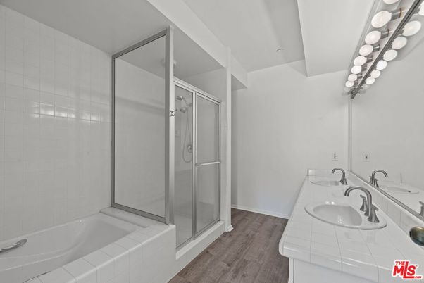 Bathroom, Dual Sink Vanities, Glass Shower, Interior, Tile Countertops, Wood Texture Flooring