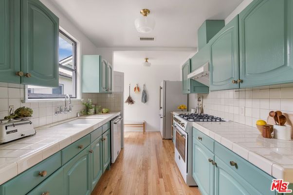 Interior, Kitchen, Stainless Steel Appliances, Tile Countertops, Wood Texture Flooring