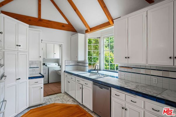 Interior, Kitchen, Tile Countertops, Washer, Wooden Beams, Wood Texture Flooring
