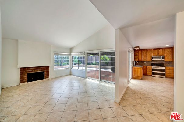 Empty room, Fireplace, Interior, Kitchen, Recessed Lighting, Stainless Steel Appliances