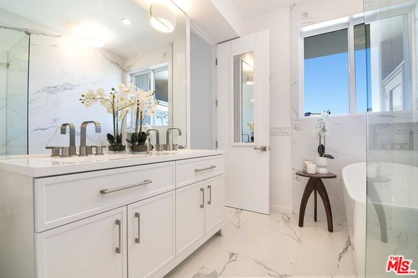 Bathroom, Dual Sink Vanities, Glass Shower, Interior, Marble, Marble Walls, Recessed Lighting