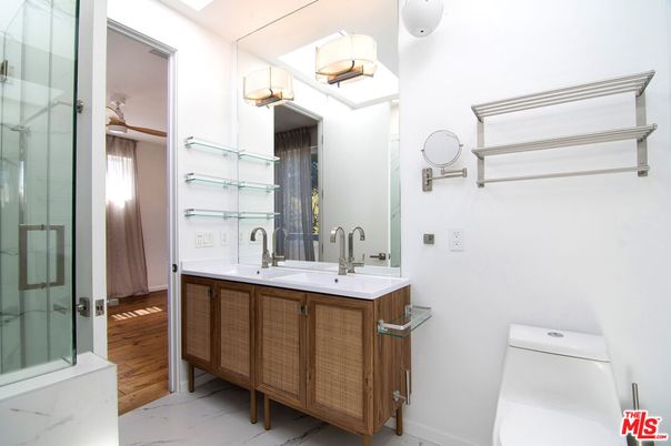 Bathroom, Dual Sink Vanities, Glass Shower, Interior, Marble, Wood Texture Flooring