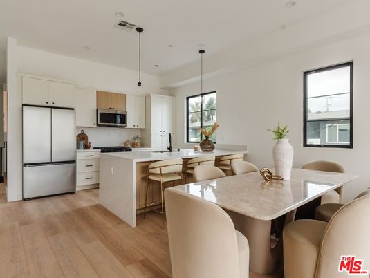 Dining room, Interior, Kitchen, Pendant Lights, Recessed Lighting, Stainless Steel Appliances, Wood Texture Flooring