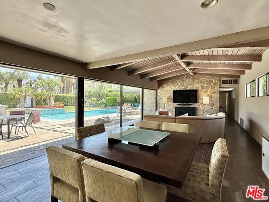 Dining room, Fireplace, Interior, Living room, Pool, Stone Walls, Wooden Beams, Wooden Ceilings, Wood Texture Flooring