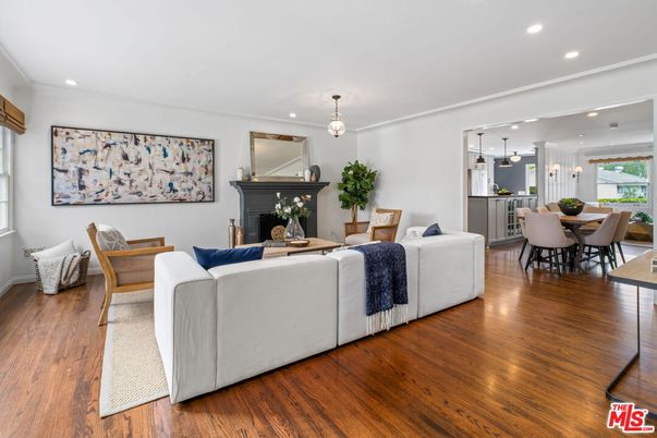 Dining room, Fireplace, Interior, Living room, Pendant Lights, Recessed Lighting, Wood Texture Flooring