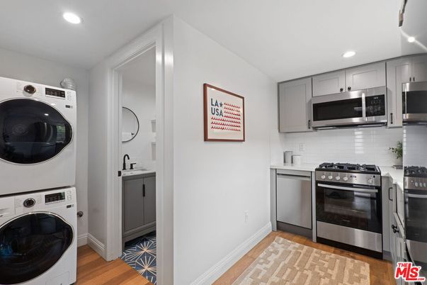 Interior, Kitchen, Recessed Lighting, Stainless Steel Appliances, Utility Closets, Washer, Wood Texture Flooring