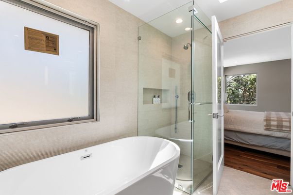 Bathroom, Free Standing Baths, Glass Shower, Interior, Recessed Lighting, Wood Texture Flooring