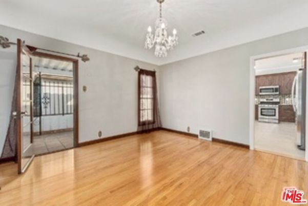 Chandelier, Empty room, Interior, Kitchen, Stainless Steel Appliances, Wood Texture Flooring