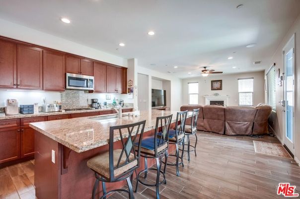Fireplace, Interior, Kitchen, Living room, Recessed Lighting, Wood Texture Flooring