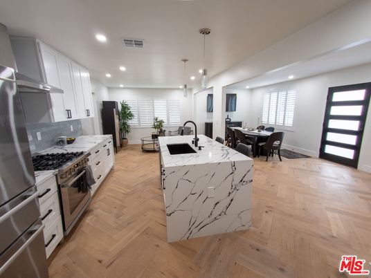 Dining room, Interior, Kitchen, Pendant Lights, Recessed Lighting, Stainless Steel Appliances, Wood Texture Flooring