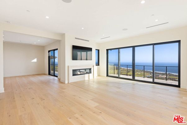 Empty room, Fireplace, Interior, Recessed Lighting, Water, Wood Texture Flooring