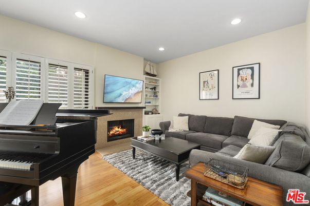 Fireplace, Interior, Living room, Piano, Recessed Lighting, Wood Texture Flooring