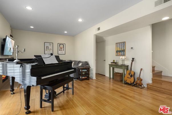 Fireplace, Interior, Piano, Recessed Lighting, Wood Texture Flooring