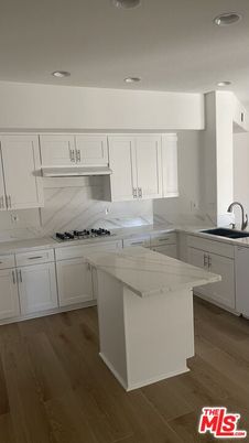 Interior, Kitchen, Marble Walls, Recessed Lighting, Wood Texture Flooring