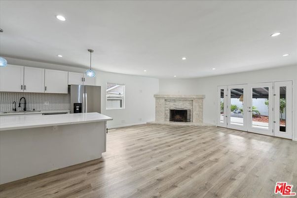 Empty room, Fireplace, Interior, Kitchen, Pendant Lights, Recessed Lighting, Wood Texture Flooring