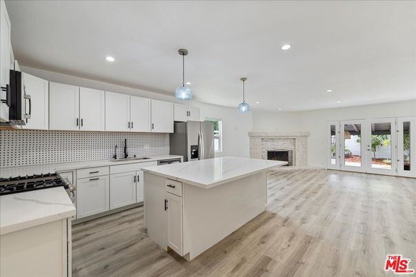 Fireplace, Interior, Kitchen, Pendant Lights, Recessed Lighting, Stainless Steel Appliances, Wood Texture Flooring