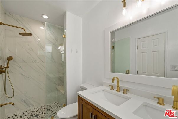 Bathroom, Dual Sink Vanities, Glass Shower, Interior, Marble Walls, Recessed Lighting