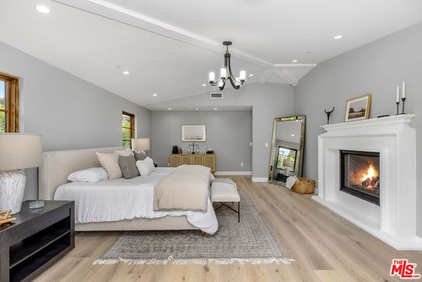 Bedroom, Chandelier, Fireplace, Interior, Recessed Lighting, Wood Texture Flooring