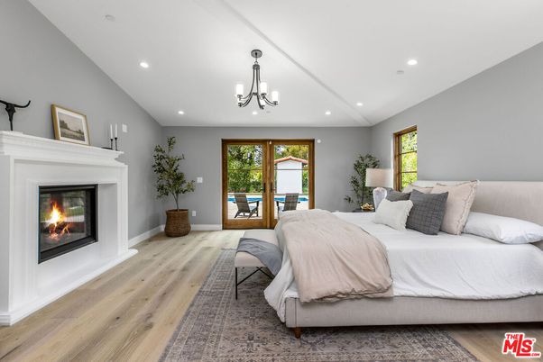 Bedroom, Chandelier, Fireplace, Interior, Recessed Lighting, Wood Texture Flooring