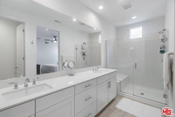 Bathroom, Dual Sink Vanities, Glass Shower, Interior, Recessed Lighting, Wood Texture Flooring
