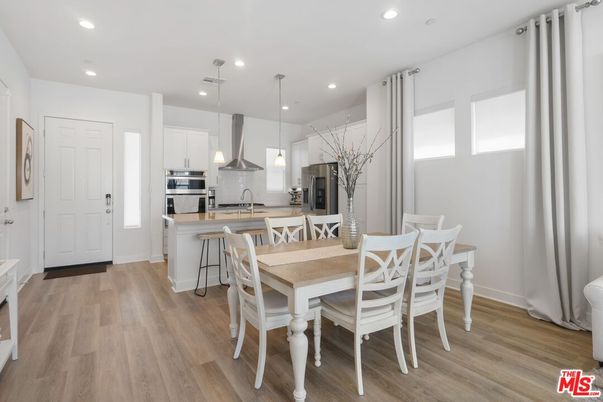 Dining room, Interior, Kitchen, Pendant Lights, Recessed Lighting, Stainless Steel Appliances, Wood Texture Flooring