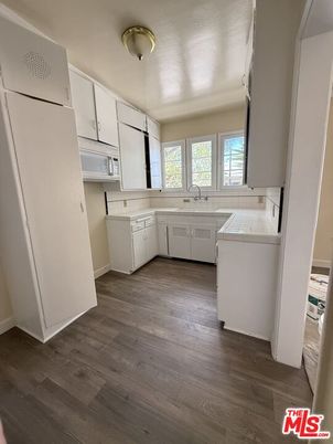 Interior, Kitchen, Tile Countertops, Wood Texture Flooring