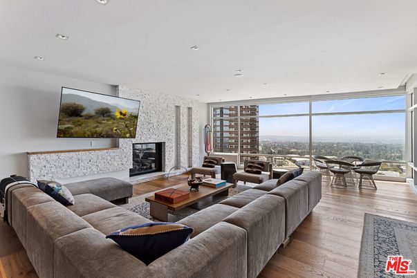 Fireplace, Interior, Living room, Recessed Lighting, Stone Walls, Wood Texture Flooring