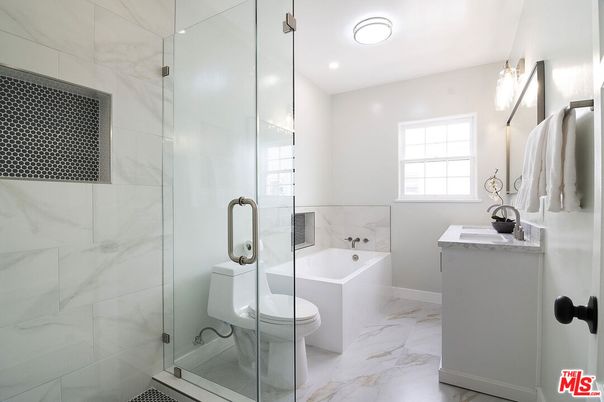 Bathroom, Dual Sink Vanities, Glass Shower, Interior, Marble, Marble Walls, Recessed Lighting