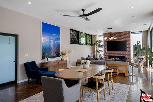 Dining room, Fireplace, Interior, Living room, Recessed Lighting, Stone Walls, Wood Texture Flooring