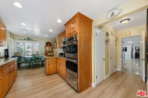 Dining room, Interior, Kitchen, Recessed Lighting, Stainless Steel Appliances, Wood Texture Flooring