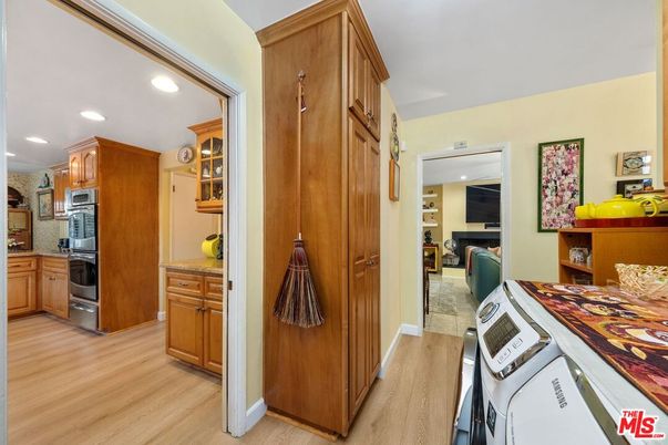 Interior, Kitchen, Recessed Lighting, Washer, Wood Texture Flooring
