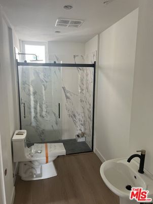 Bathroom, Glass Shower, Interior, Marble Walls, Wood Texture Flooring