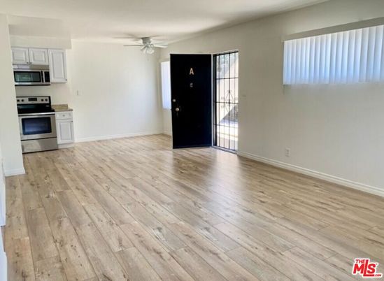 Empty room, Interior, Kitchen, Stainless Steel Appliances, Wood Texture Flooring