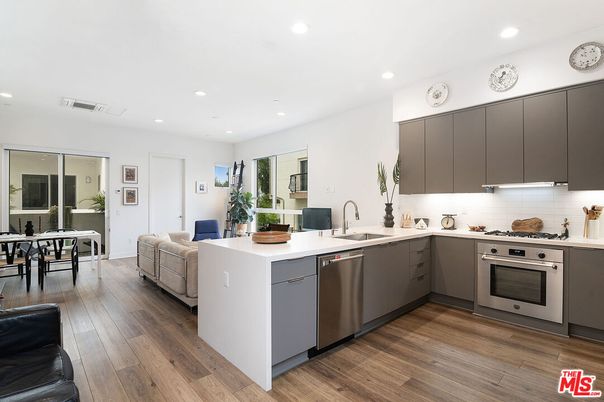 Dining room, Interior, Kitchen, Living room, Recessed Lighting, Stainless Steel Appliances, Wood Texture Flooring