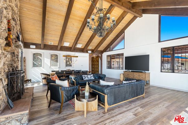 Chandelier, Dining room, Fireplace, Interior, Living room, Stone Walls, Wooden Beams, Wooden Ceilings, Wood Texture Flooring