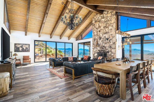 Chandelier, Dining room, Fireplace, Interior, Living room, Pendant Lights, Stone Walls, Wooden Beams, Wooden Ceilings, Wood Texture Flooring
