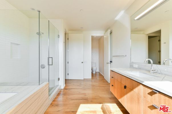 Bathroom, Dual Sink Vanities, Glass Shower, Interior, Recessed Lighting, Wood Texture Flooring