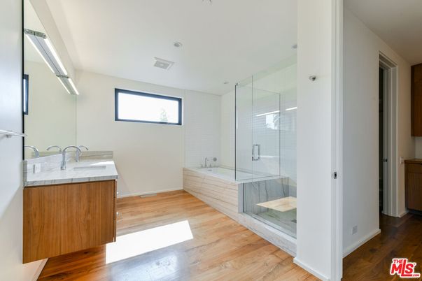 Bathroom, Glass Shower, Interior, Recessed Lighting, Tile Countertops, Wood Texture Flooring