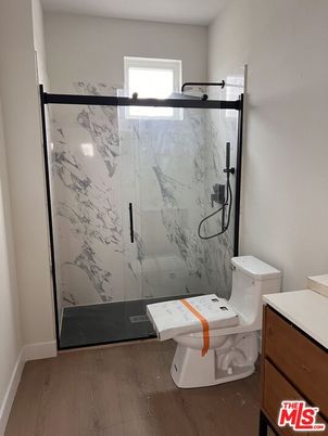 Bathroom, Glass Shower, Interior, Marble Walls, Wood Texture Flooring