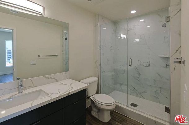 Bathroom, Glass Shower, Interior, Marble Walls, Recessed Lighting, Wood Texture Flooring