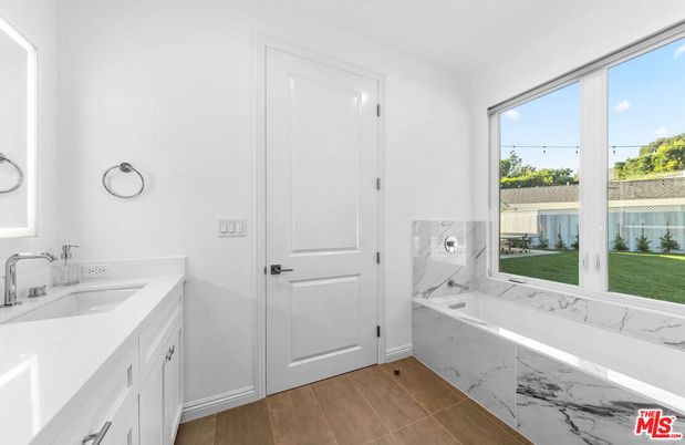 Bathroom, Dual Sink Vanities, Interior, Marble Walls, Wood Texture Flooring